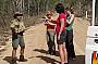The driver catches a frill necked lizard to show the guests.h